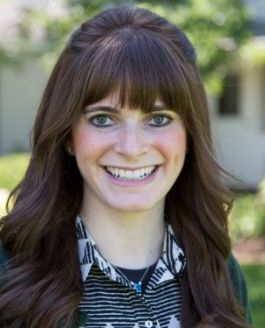 Woman smiling for camera.